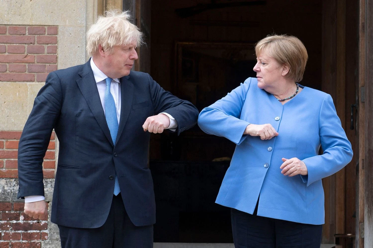 Borisas Johnsonas, Jungtinės Karalystės premjeras ir Angela Merkel, Vokietijos kanclerė. David Rose („AFP“ / „Scanpix“) nuotr. 