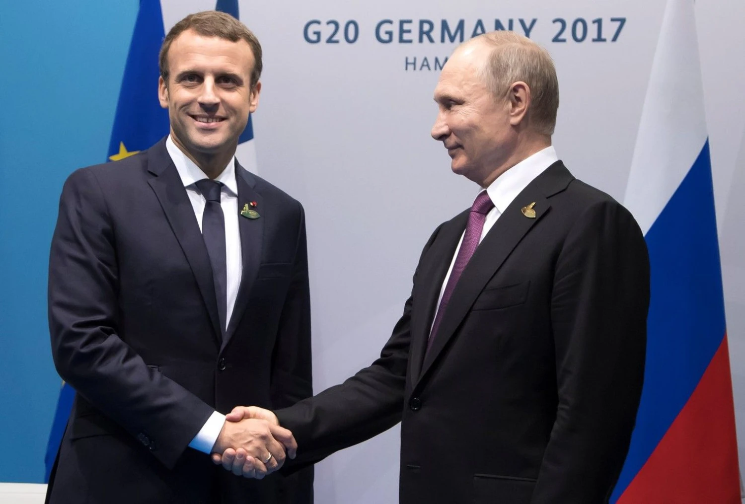 Emmanuelis Macronas, Prancūzijos prezidentas, ir Vladimiras Putinas, Rusijos vadovas. Iano Langsdono („Reuters“ / „Scanpix“) nuotr.