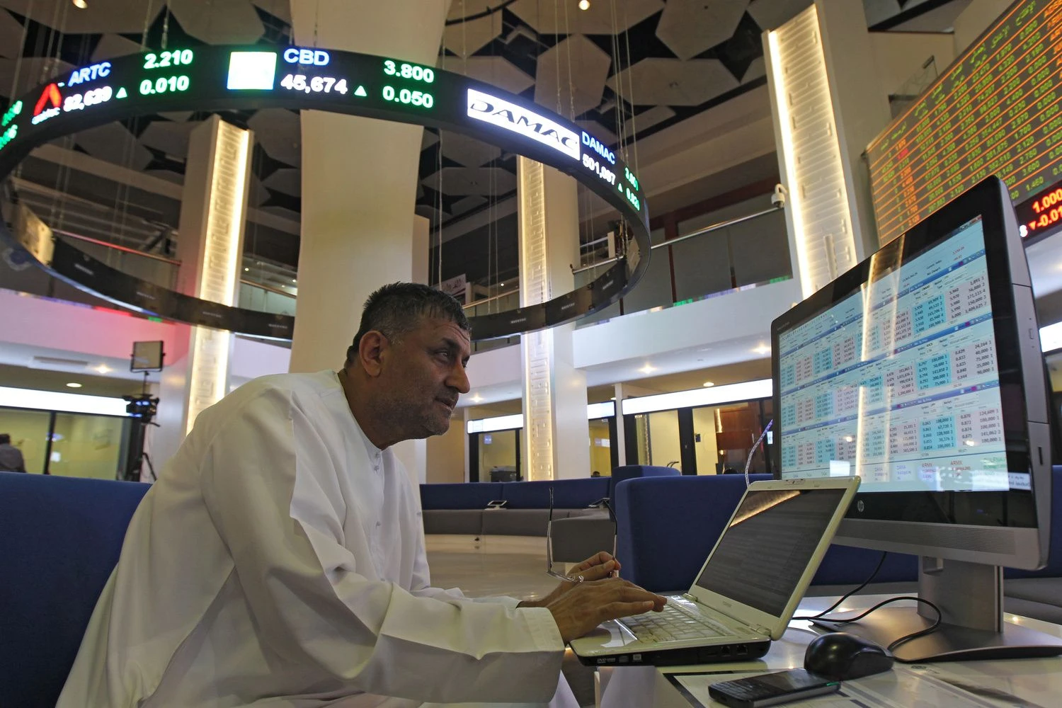 An investor is seen at the Dubai International Financial Market, in Dubai, UAE  April,16, 2018. REUTERS/Satish Kumar