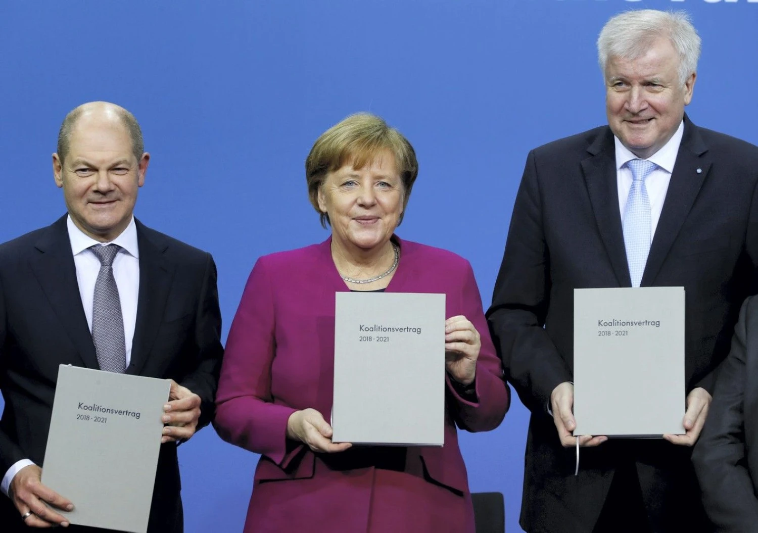 Angela Merkel, Horstas Seehoferis ir Olafas Scholzas. Fabrizio Benscho (Reuters / Scanpix) nuotr.