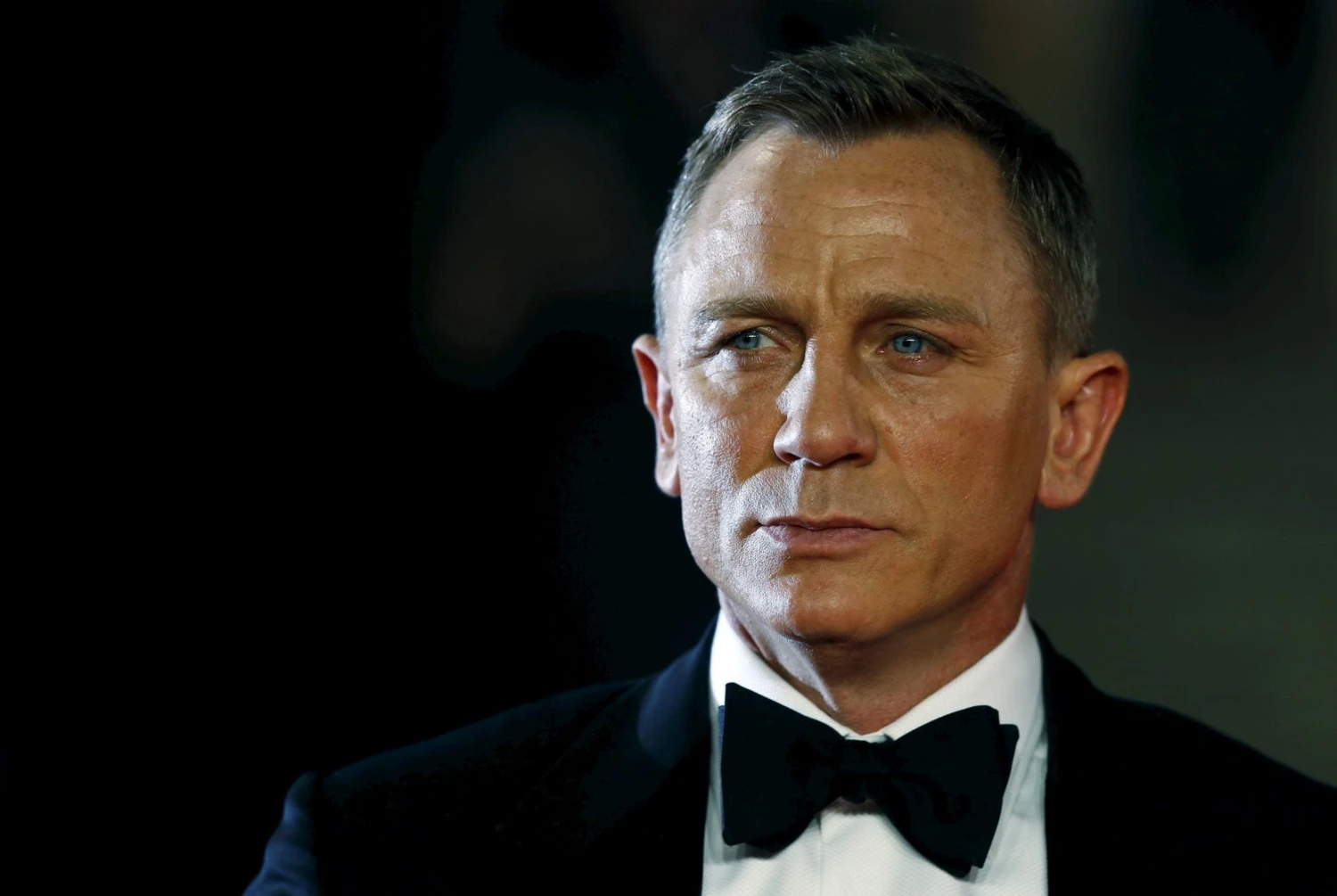 Danielis Craigas agentą 007 vaidins ir 9-oje serijoje. Luke‘o MacGregoro/REUTERS nuotr. 