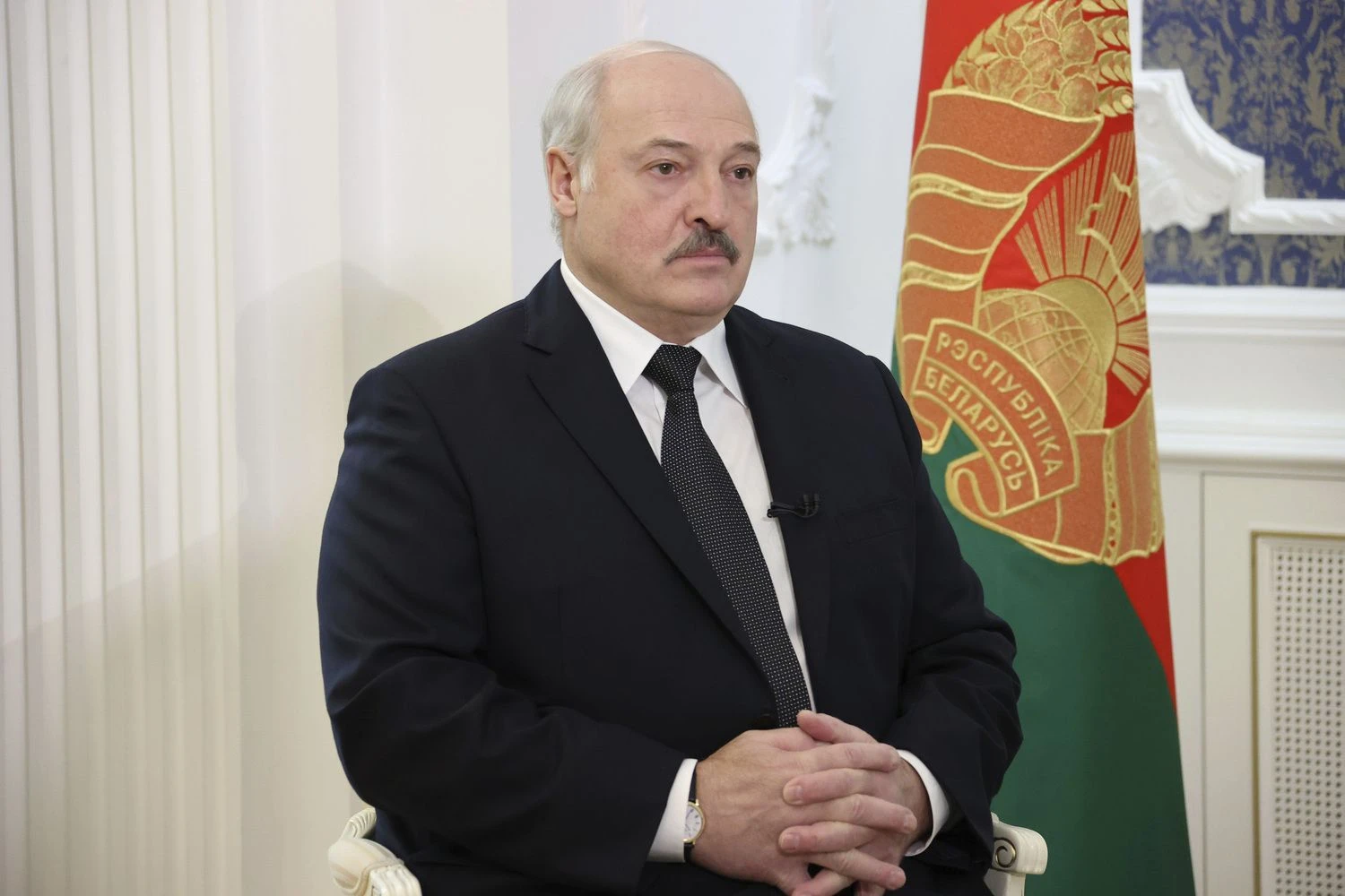 Belarusian President Aleksandr Lukashenko speaks during his interview with the Russian magazine of the Natsionalnaya Oborona (National Defense) in Minsk, Belarus, Tuesday, Nov. 9, 2021. (Nikolai Petrov/BelTA Pool Photo via AP)