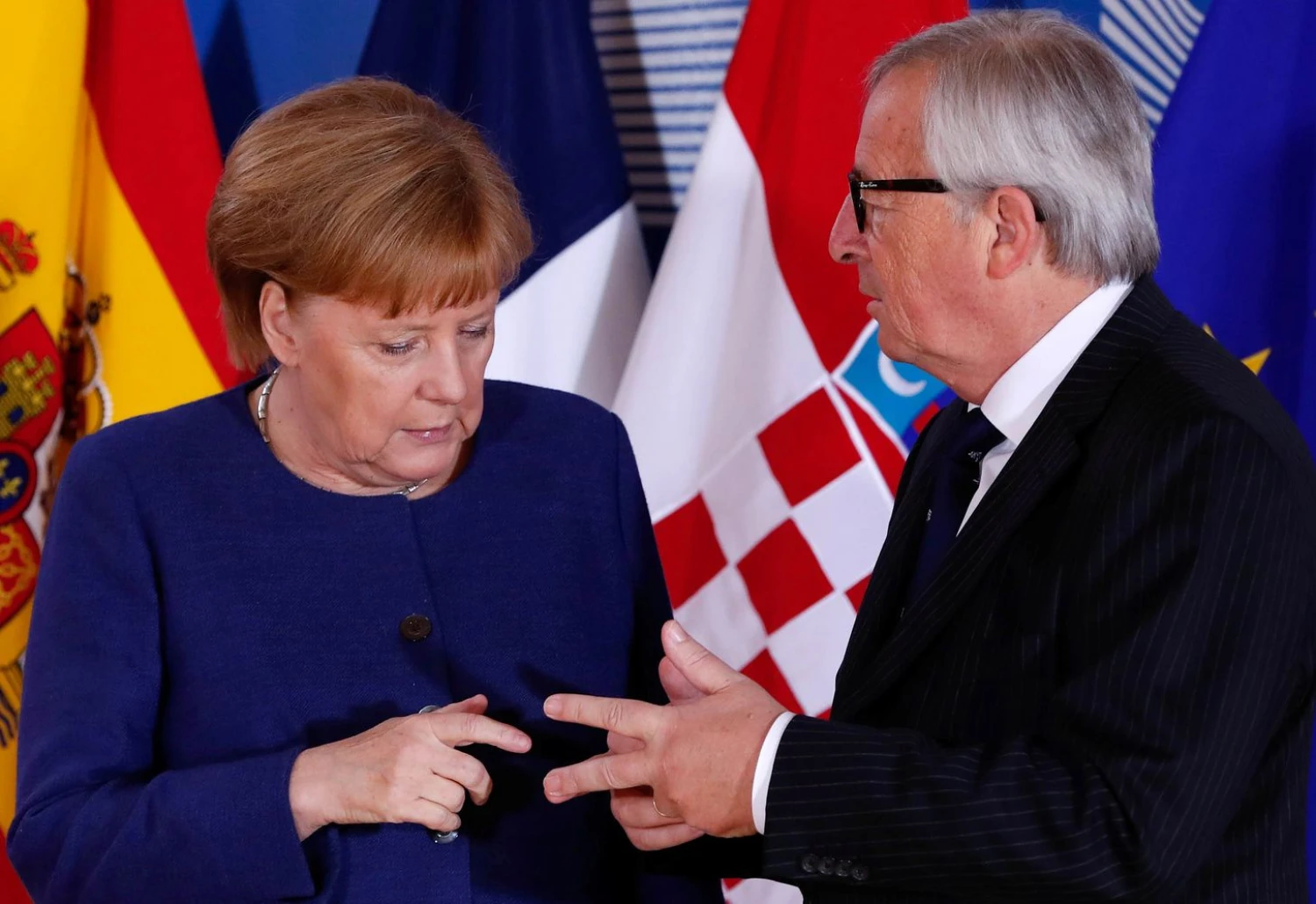 Vokietijos kanclerė Angela Merkel ir Europos Komisijos pirmininkas Jeanas Claude‘as Junckeris. Yveso Hermano („Reuters“ / „Scanpix“) nuotr. 