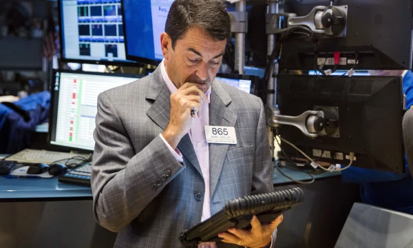 A trader works on the floor of the New York Stock Exchange shortly after the market opened in New York September 4, 2015.  REUTERS/Lucas Jackson 