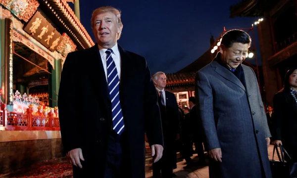 U.S. President Donald Trump and China's President Xi Jinping leave after an opera performance at the Forbidden City in Beijing, China, November 8, 2017. REUTERS/Jonathan Ernst