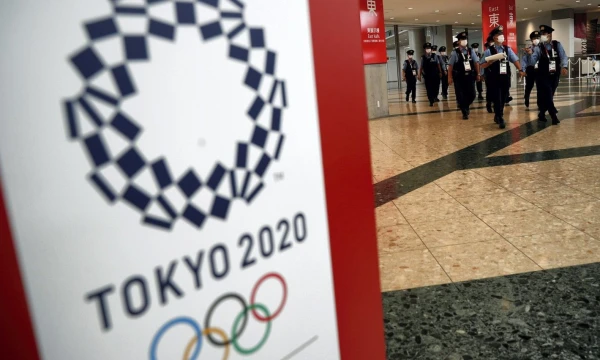 Tokijas ruošiasi atidėtosioms, bet vis vien koronaviruso pandemijos sąlygomis vyksiančioms olimpinėms žaidynėms. Edgar Su (Reuters/Scanpix) nuotr. 