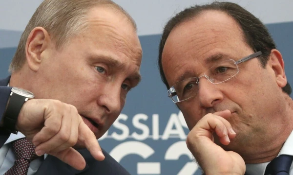 Vladimiras Putinas, karo nusikaltimais kaltinamas Rusijos diktatorius, ir Francois Hollande’as, buvęs Prancūzijos prezidentas, 2013 m. rugsėjo 6 d. Sergejaus Karpuchino („Scanpix“) nuotr.