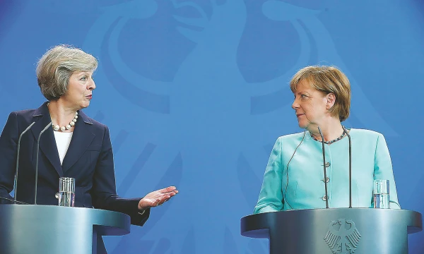 Angela Merkel, Vokietijos kanclerė, ir Theresa May, JK premjerė, iki šiol retai rasdavo bendrą kalbą dėl „Brexit“ eigos. Tačiau dabar atsiranda požymių, kad pasiekti susitarimą gali pavykti.
Hannibalo HanschkEs („REUTERS“ / „scanpix“) nuotr.
