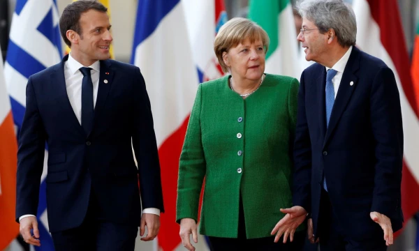 French President Emmanuel Macron, Germany's Chancellor Angela Merkel and Italy's Prime Minister Paolo Gentiloni arrive at a European Union heads of state informal meeting in Brussels, Belgium, February 23, 2018. REUTERS/Francois Lenoir