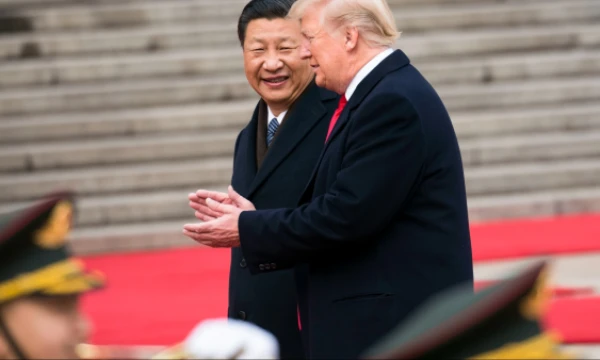 Išrinktasis JAV prezidentas Donaldas Trumpas ir Xi Jinpingas, Kinijos prezidentas, susitikimo 2017 m. lapkričio 9 d. metu. Dougo Millso („The New York Times“) nuotr. 